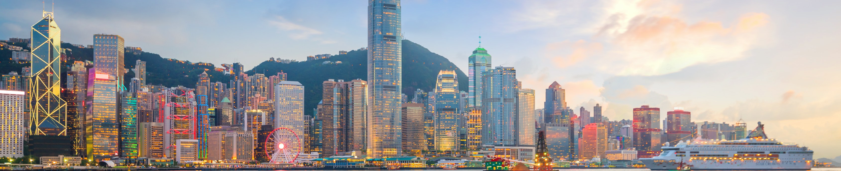 Victoria Harbour and the Hong Kong skyline at sunset, viewed from Kowloon