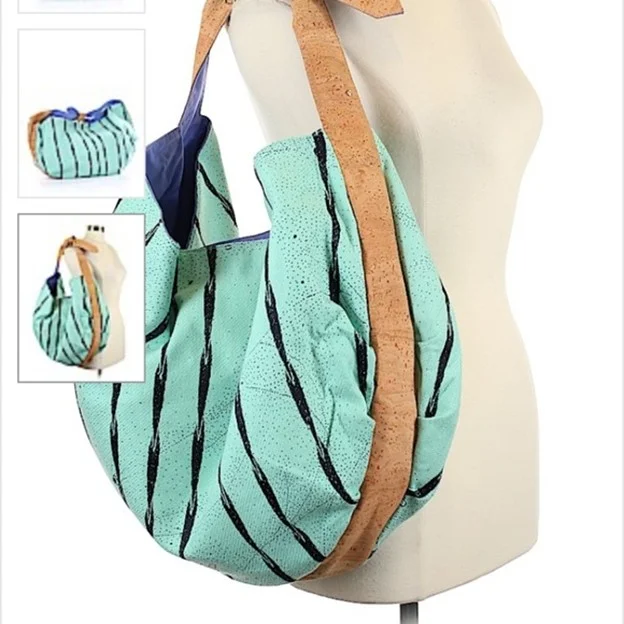 Koza designer cork shoulder bag with turquoise fabric and natural cork strap displayed on mannequin