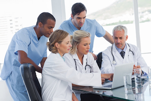 Medical team using a laptop