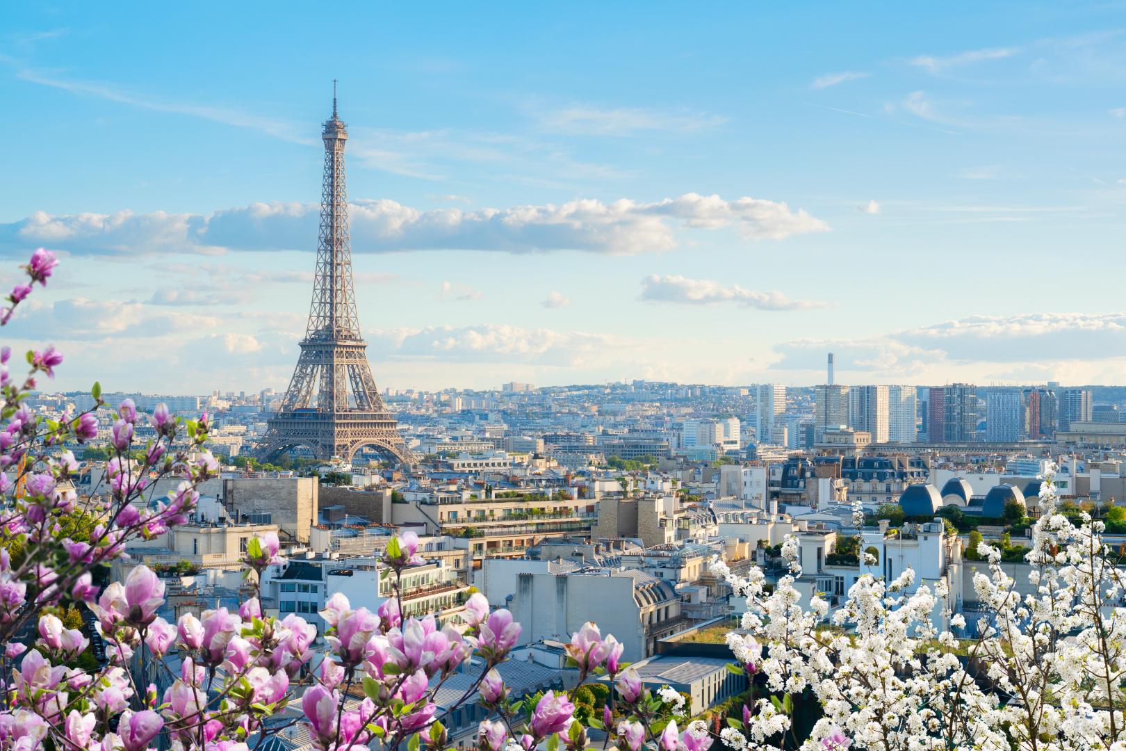 Paris skyline with the Eiffel Tower in spring, used as the hero image for the E2 visa lawyer Paris page